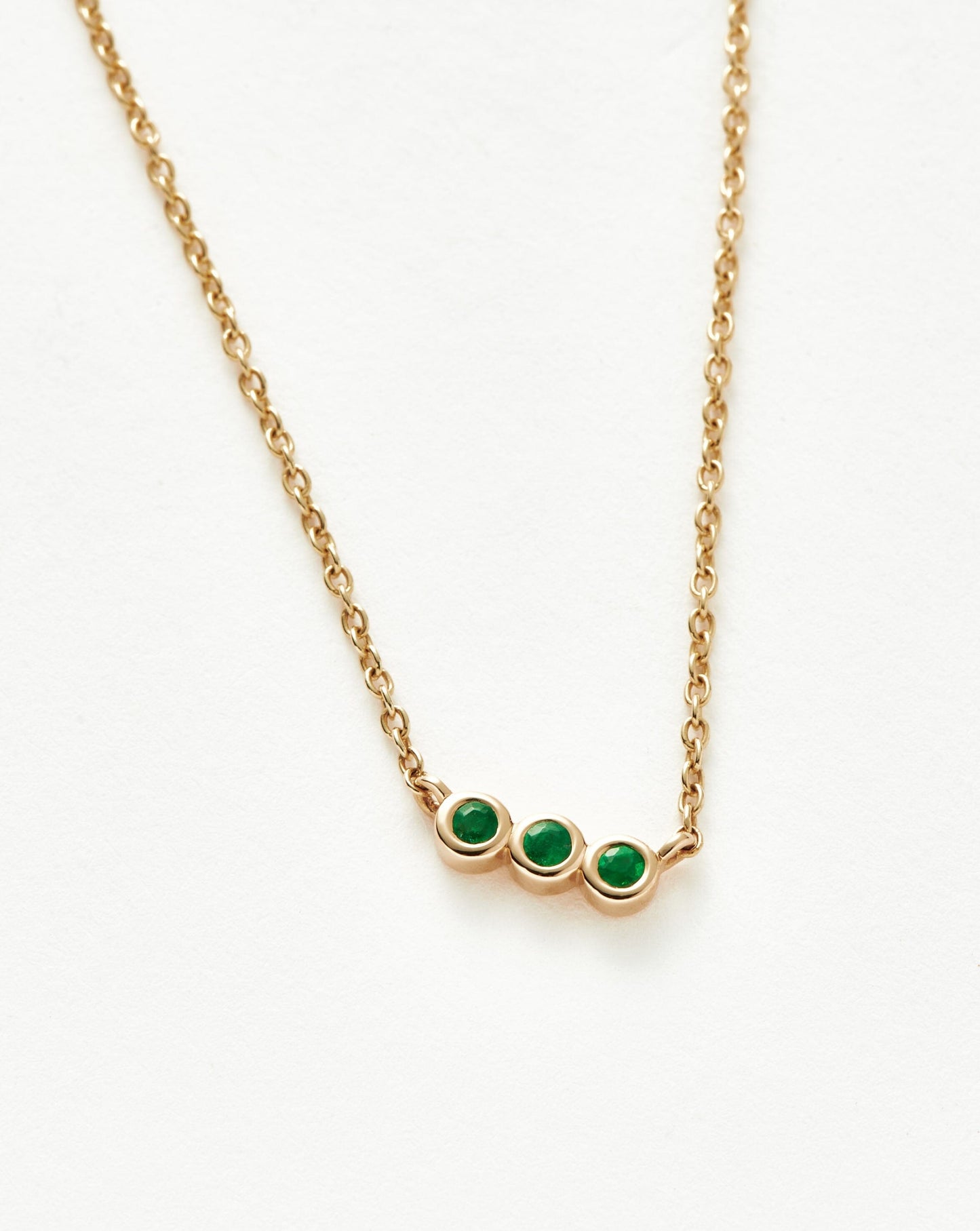Solid Gold Emerald Solitaire Trio Necklace